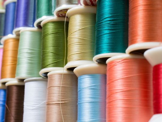 A close-up of different colorful threads, from blues to pinks, used for DIY embroidery and stitching projects.