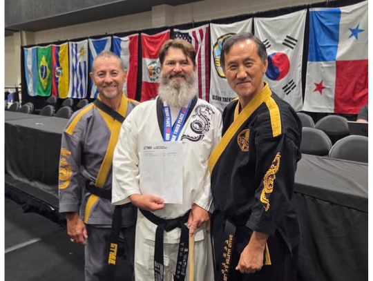 Watkins Earns 4th-Degree Black Belt and Bronze Medal