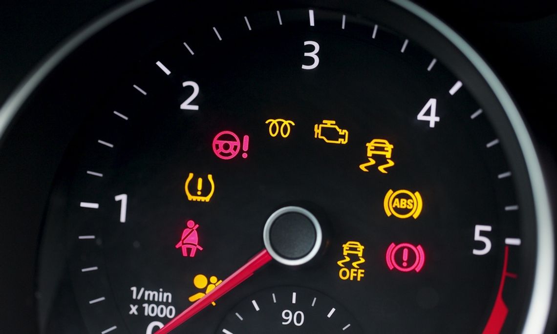 Common Car Dashboard Warning Lights and What They Mean The tachometer of a car with all of the dashboard warning lights activated, including seat belt and TPMS alerts.