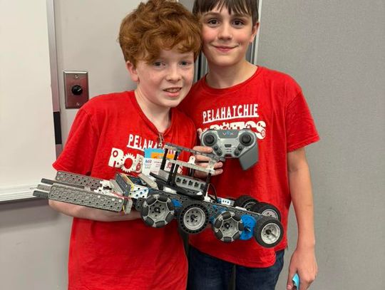 PES 6th grade robotics team members Ainsley Grammer (left) and Henry Hyde (right) placed 1st in Small But Sumo in the high school division.