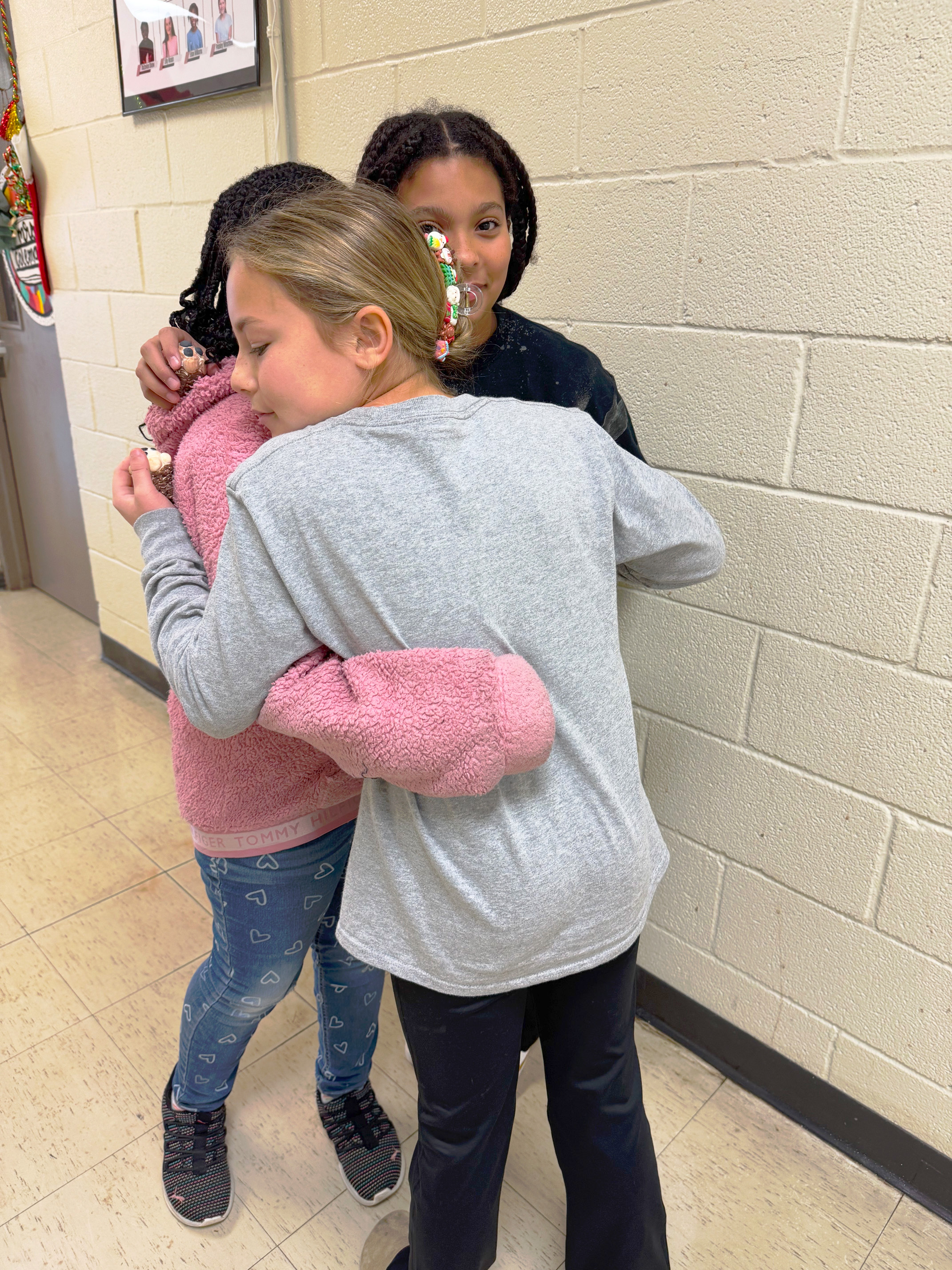 Hayzlee Nelson and Hadley Taylor with 4th grader Kinleigh Amos.